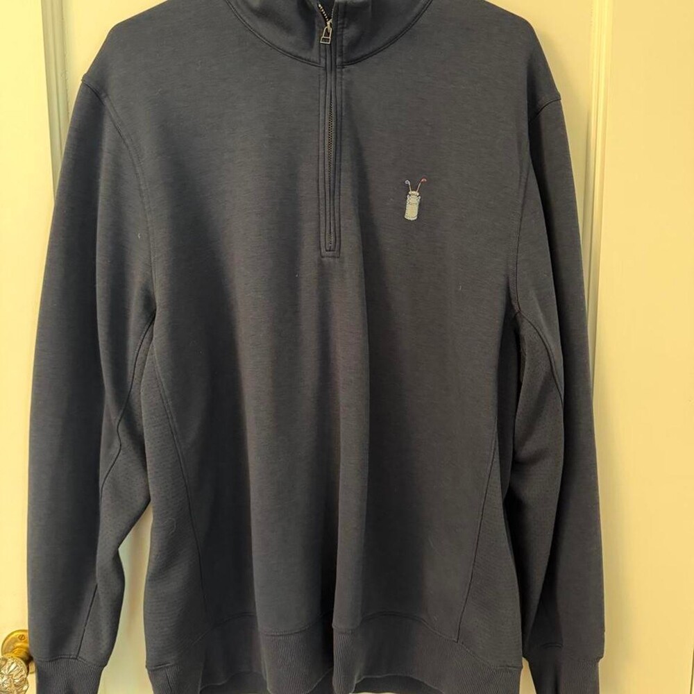 Nike Golf Dri-Fit Quarter Zip Pullover in navy blue, with embroidered gold hit i